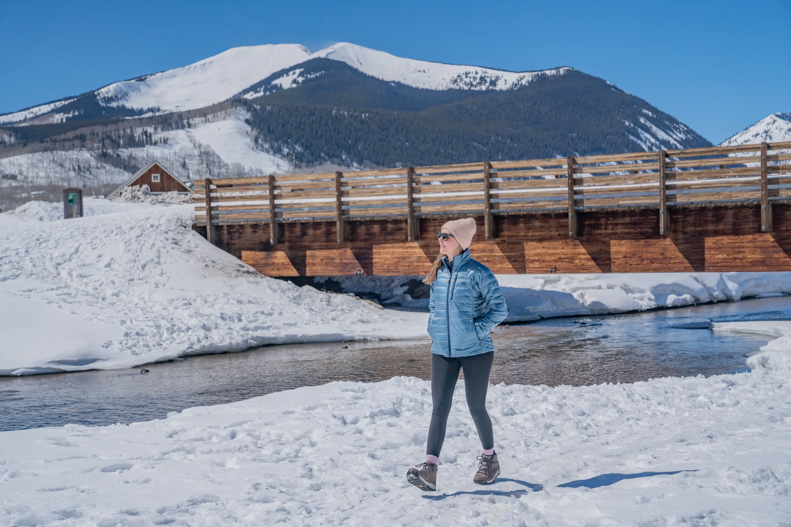 walking next to the Slate River in Crested Butte while testing women's winter boots 