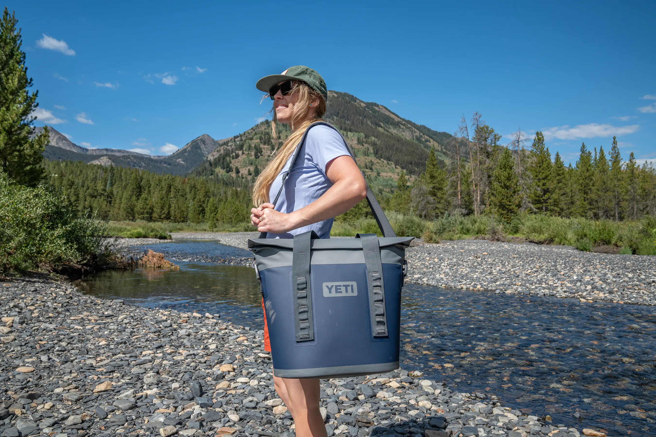 woman standing with cooler tote on shoulder 