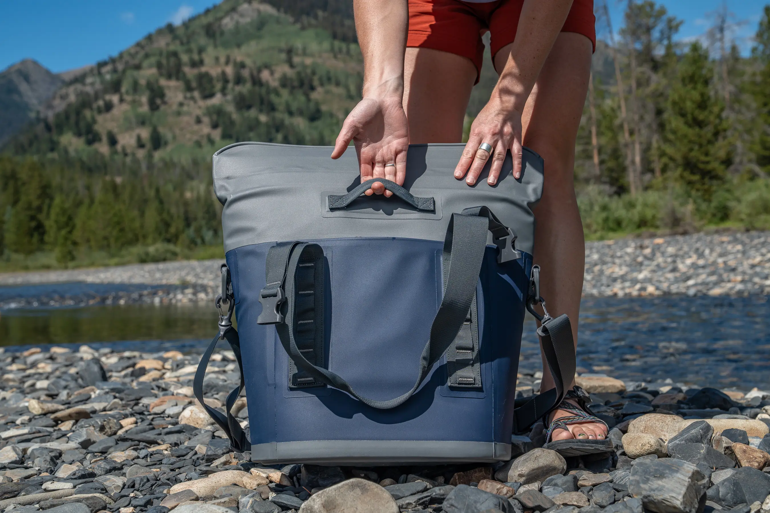 woman pulling grab handle with hand