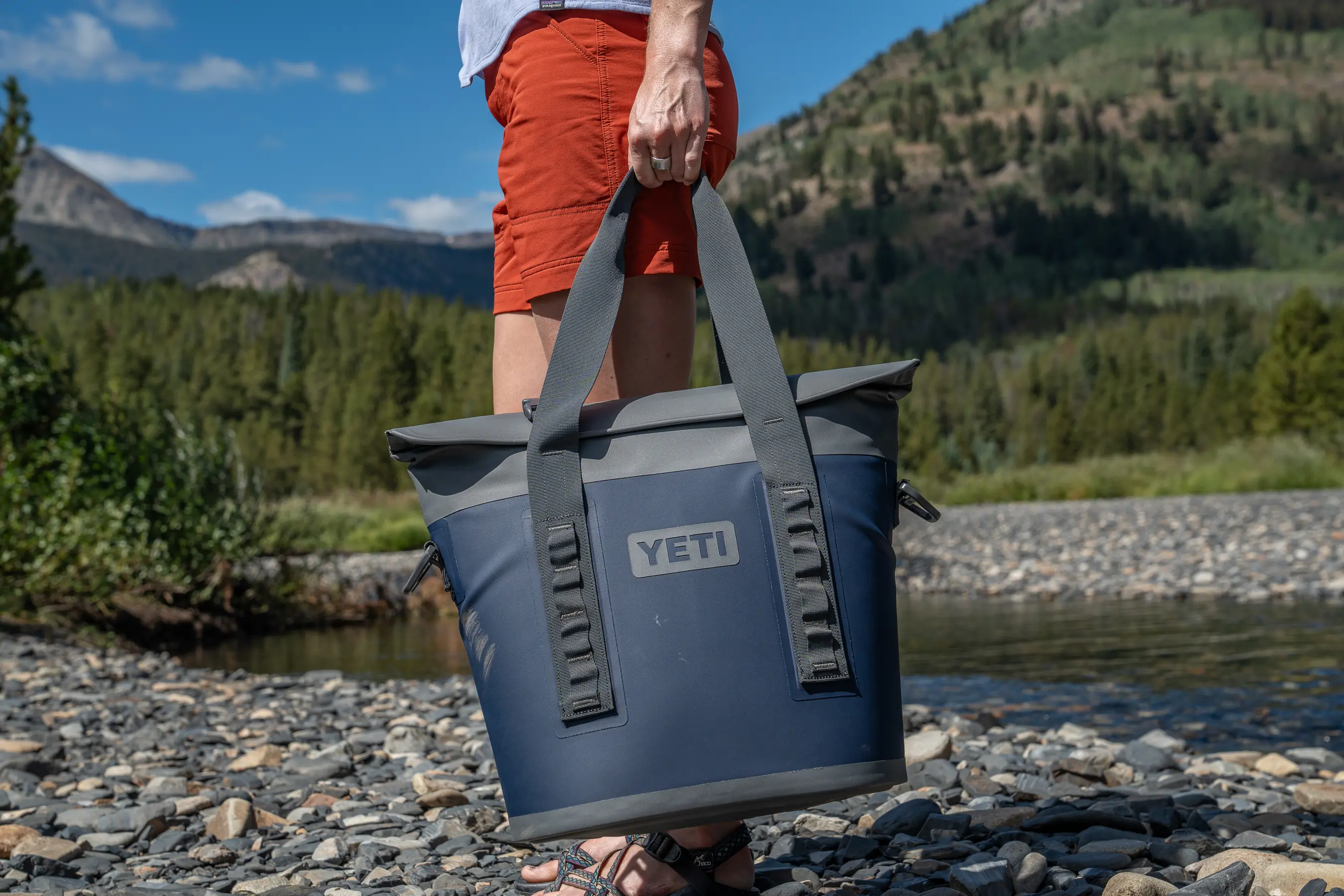 woman holding tote bag by side 