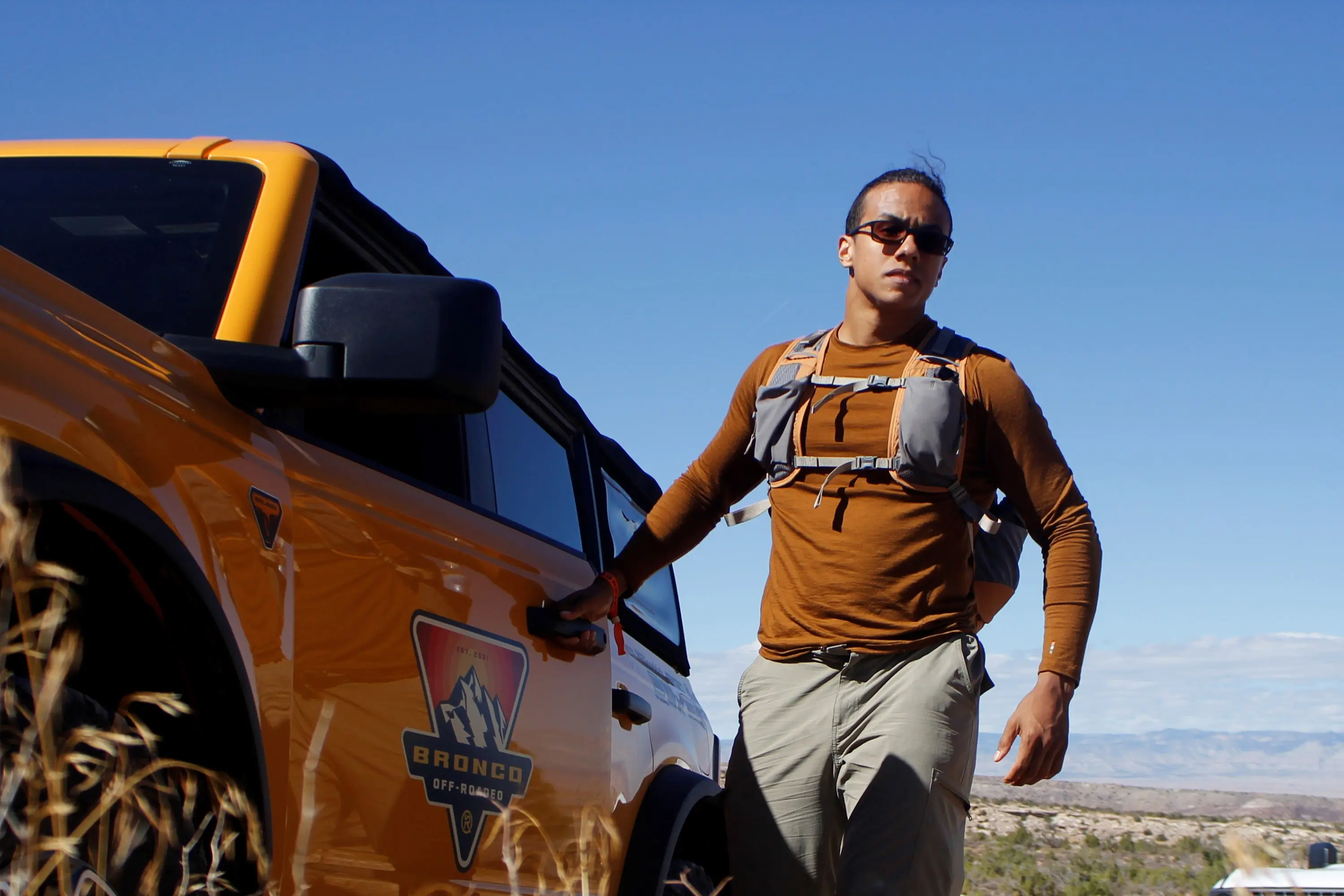 hiker wearing mystery ranch gallator backpack