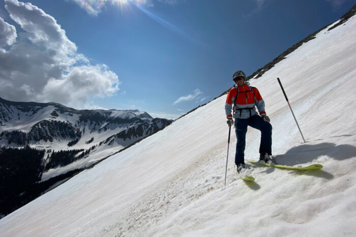 skier going down a snowy mountain