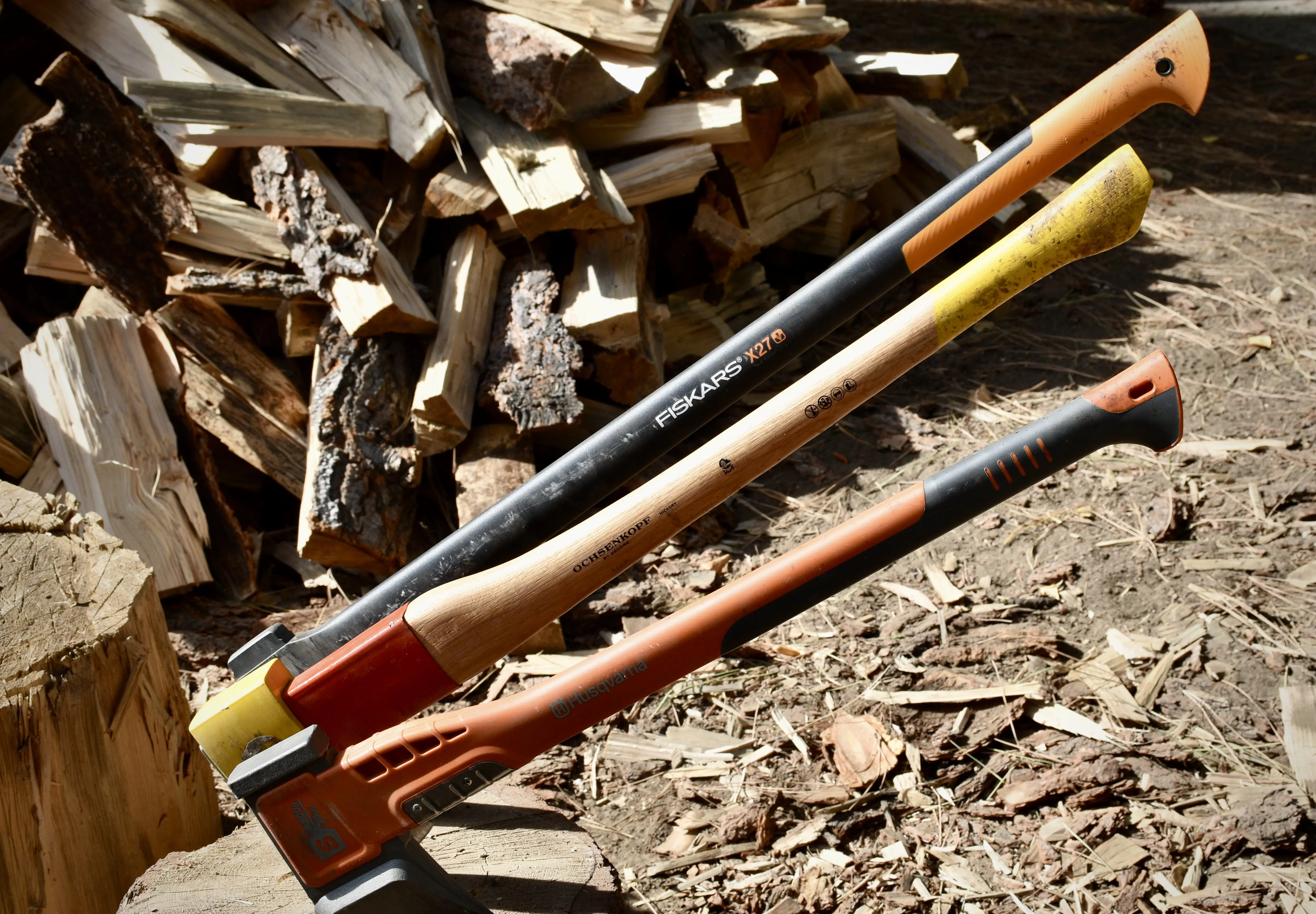 Showing the handles of the Fiskars X27, Ochsenkopf, and Husqvarna S2800 splitting axes.