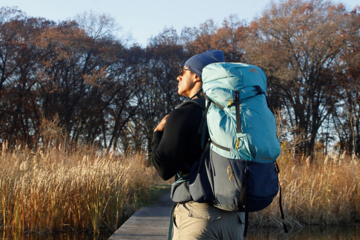 Author carrying the REI Trailmade 60 on a trail