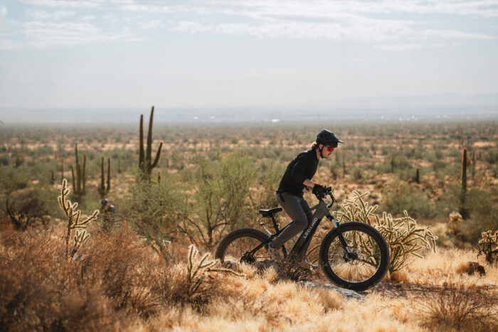 a man rides a Lectric Xpeak E-bike in the desert 
