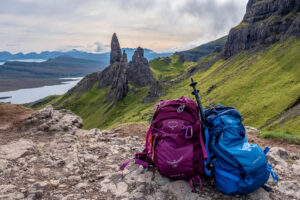 two backpacks overlook an expansive view in Scotland