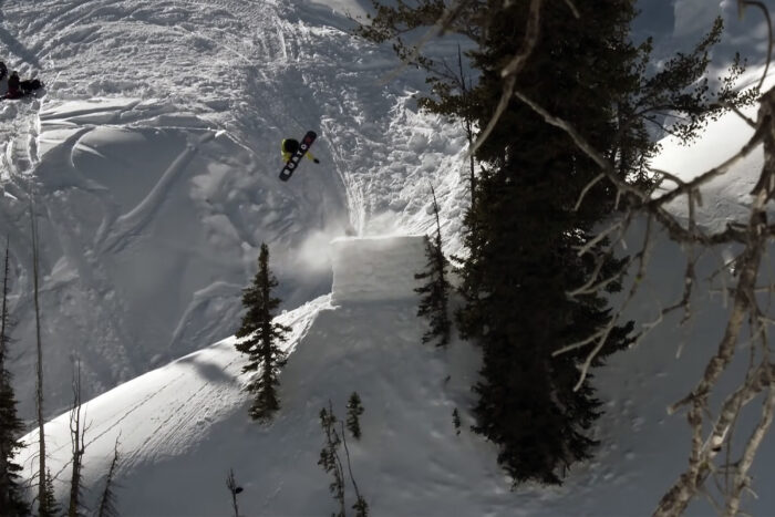 sage kotsenburg backcountry snowboarding off a big jump