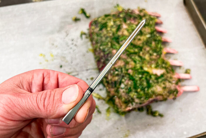 The MEATER 2 Plus in use cooking a rack of lamb;