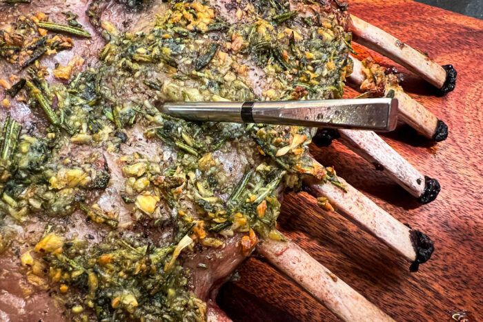 The MEATER 2 Plus in use cooking a rack of lamb;