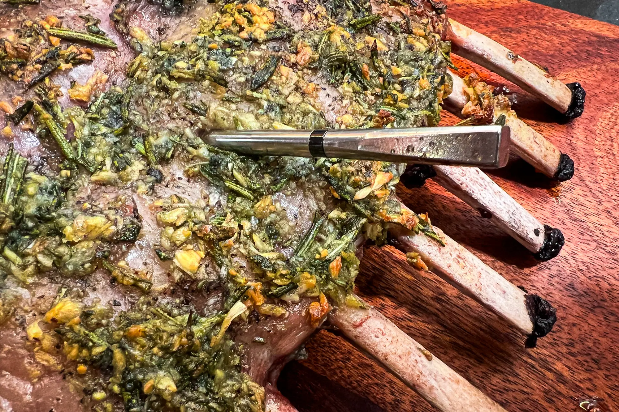 The MEATER 2 Plus in use cooking a rack of lamb;