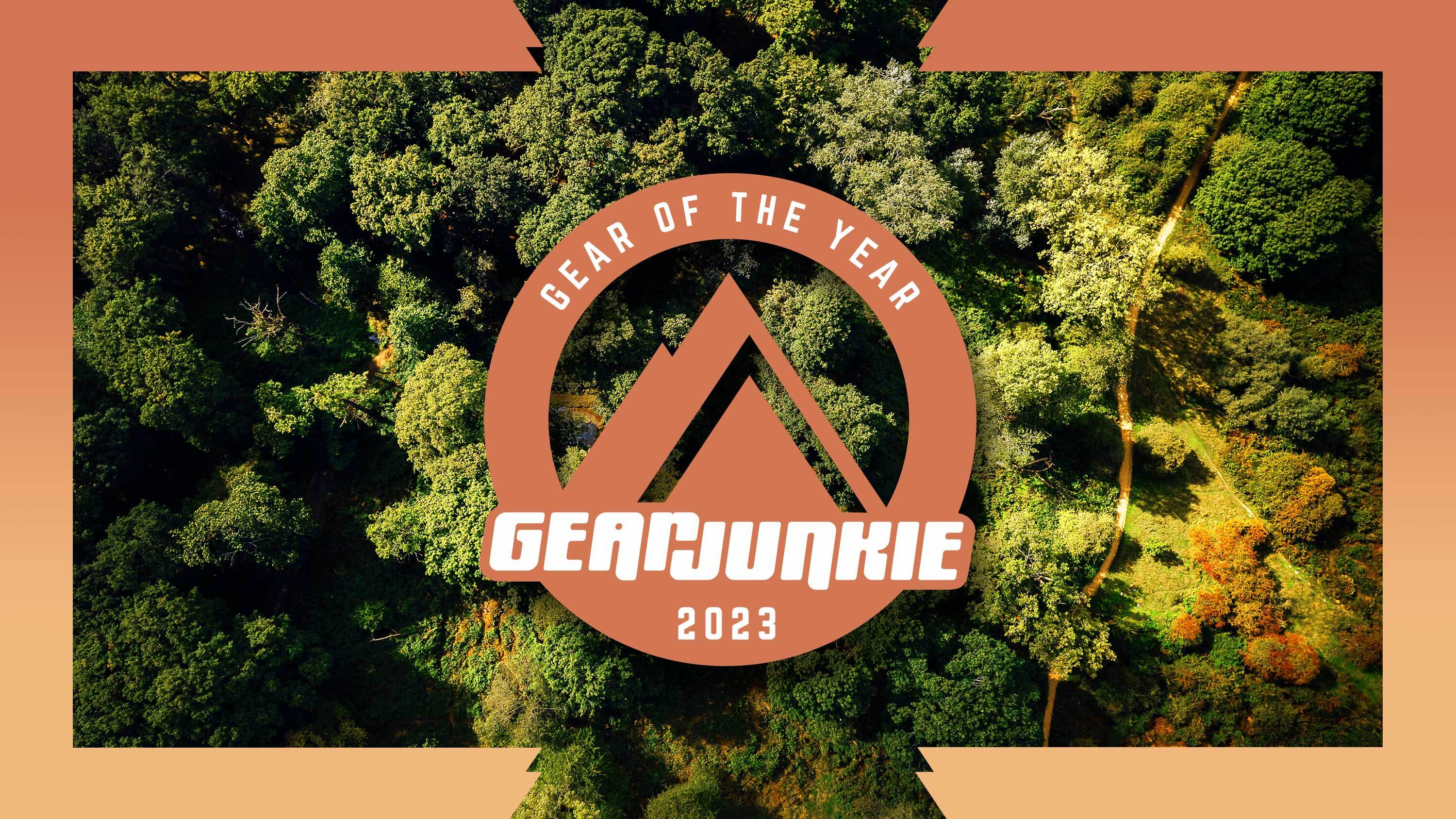 GearJunkie gear of the year 2023 logo on a forest background with an ombre orange gradient border