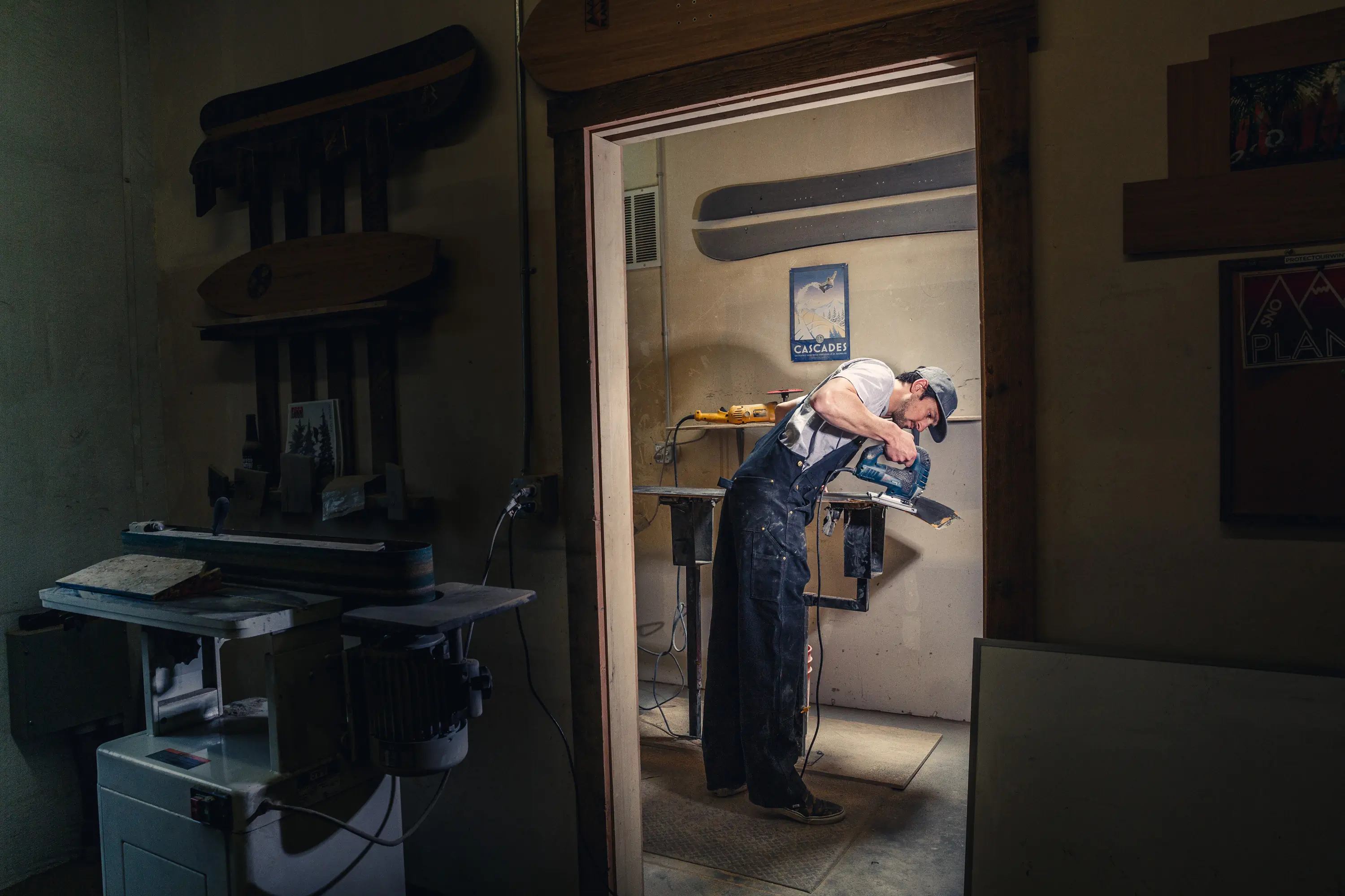 Nicol working on a SnoPlank in the Bend, Oregon shop