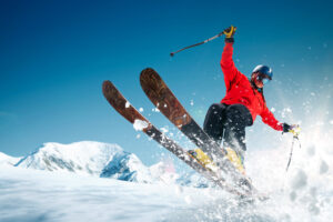 a man does a trick on a pair of skis