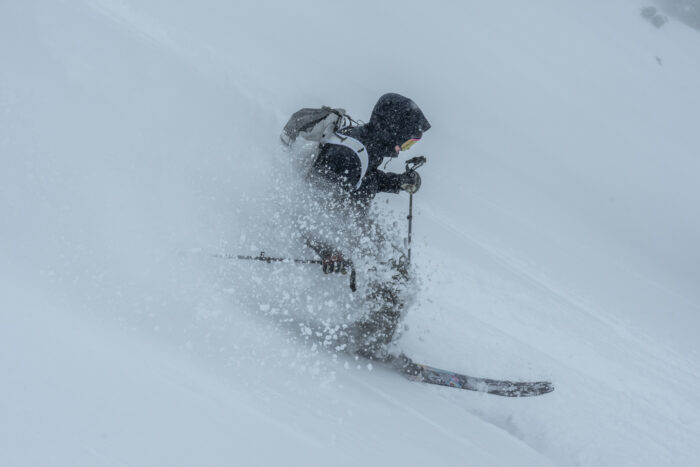 A skier in deep snow at Powder Mountain