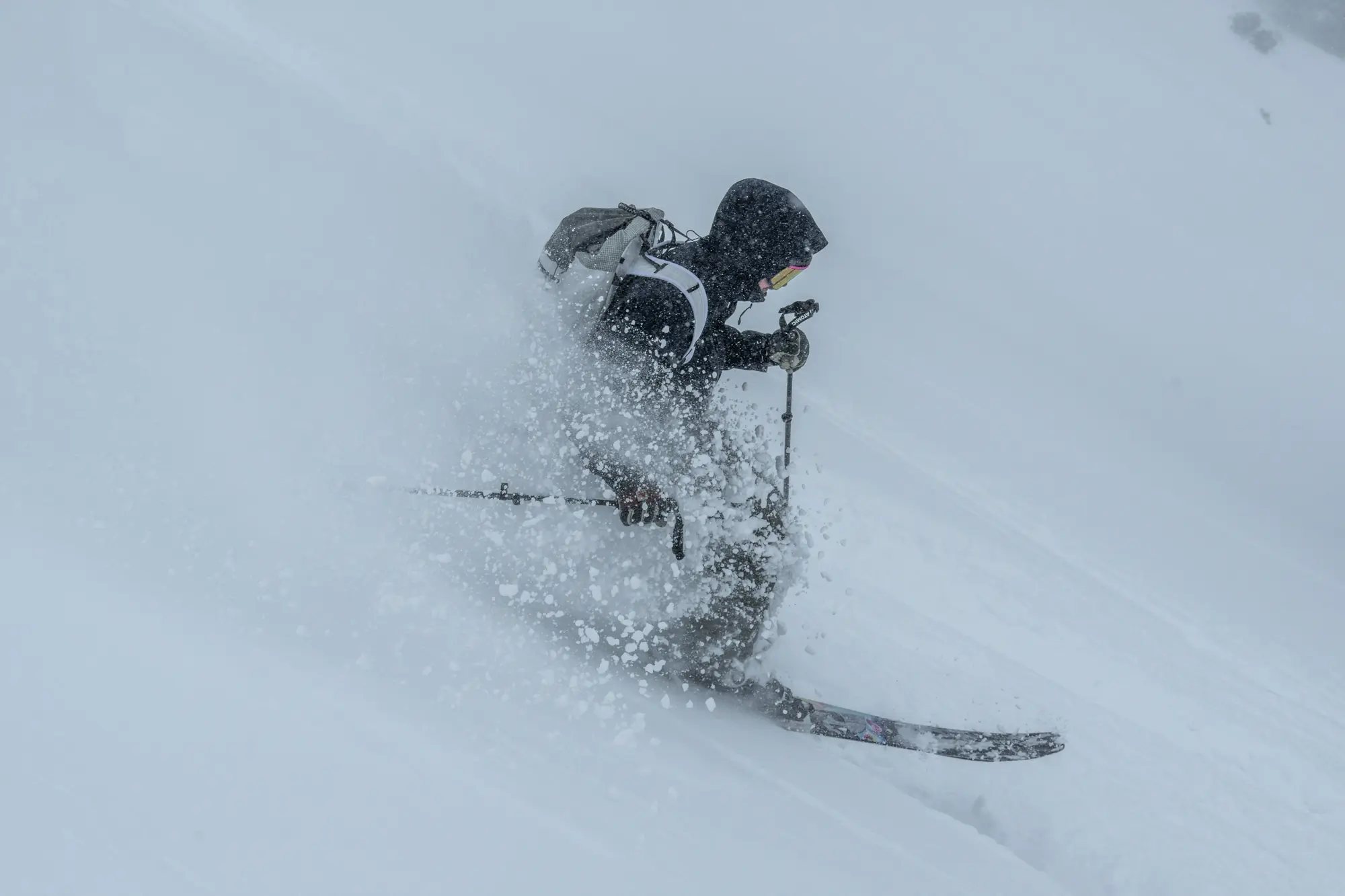 A skier in deep snow at Powder Mountain