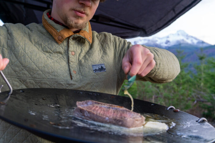 iKamper Disco Butter Basting Steaks on camping skillet