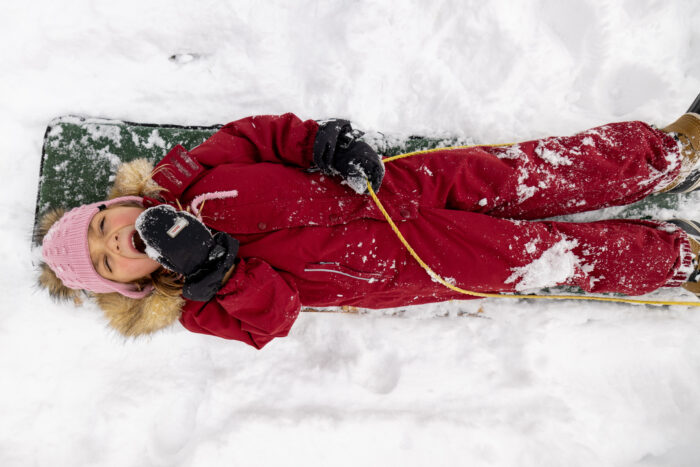 child on sled 