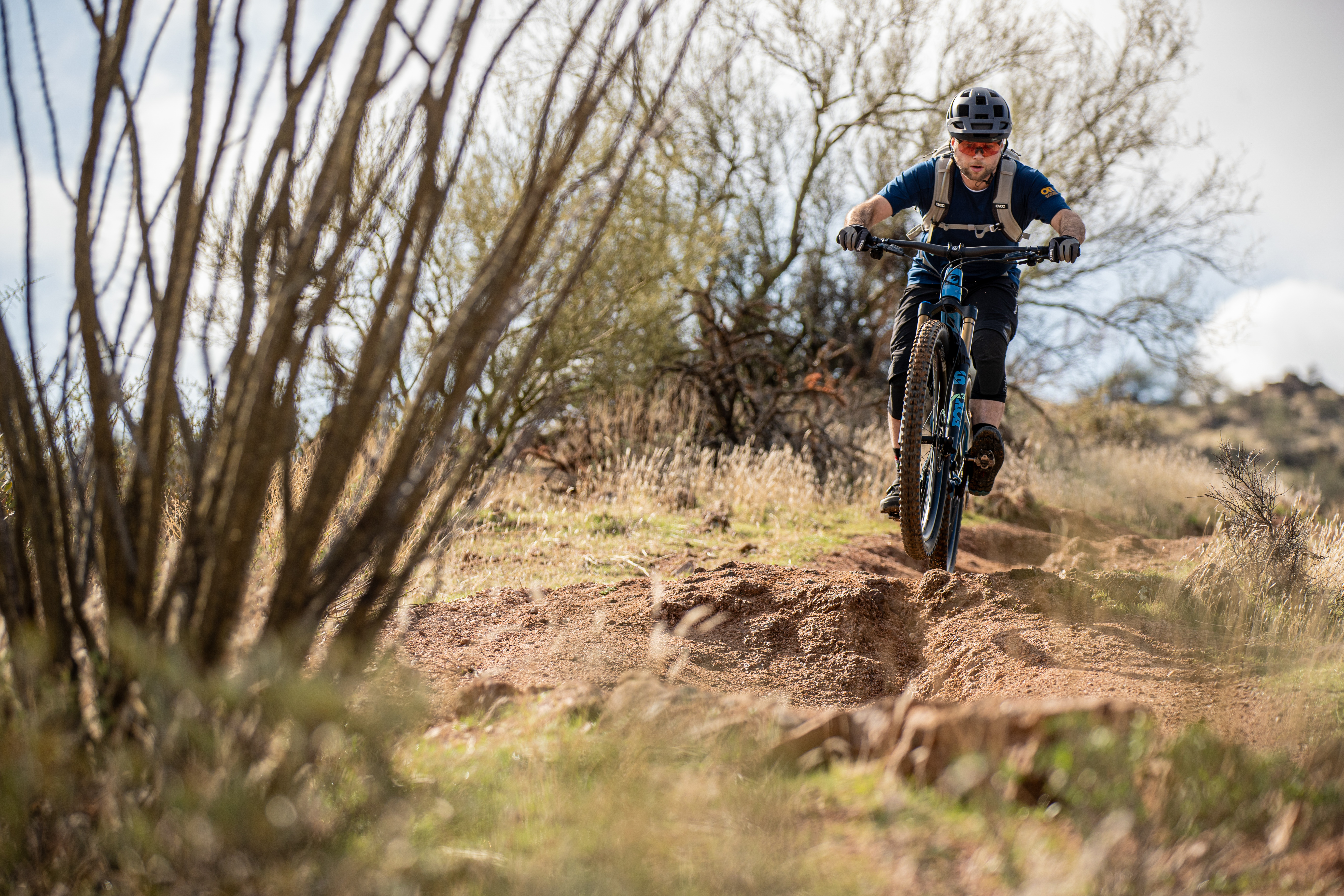 Rider on desert trail aboard the Pivot Switchblade