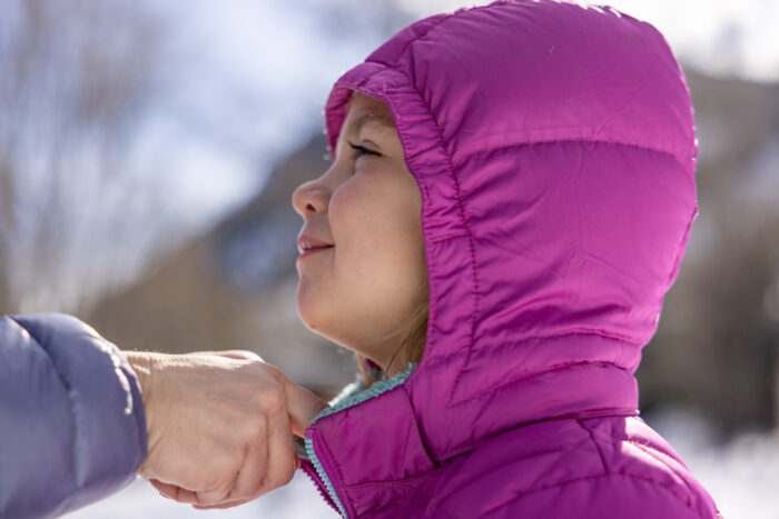 down hood pulled over little girl's head 
