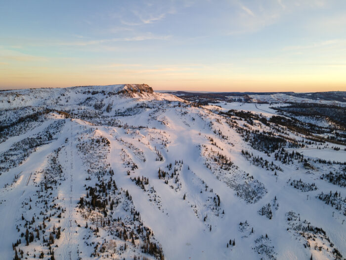 a landscape photo at sunrise of a high peak at Utah's Brian Head Resort