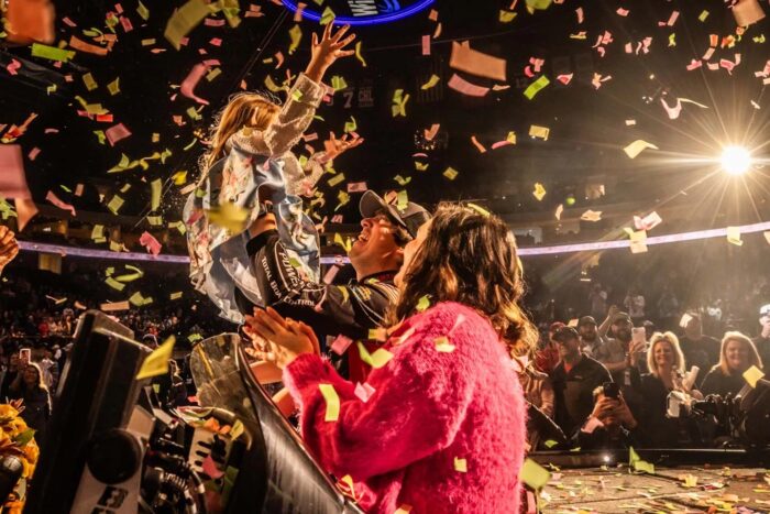 Justin Hamner Celebrates Bassmaster Classic win with wife and daugher.
