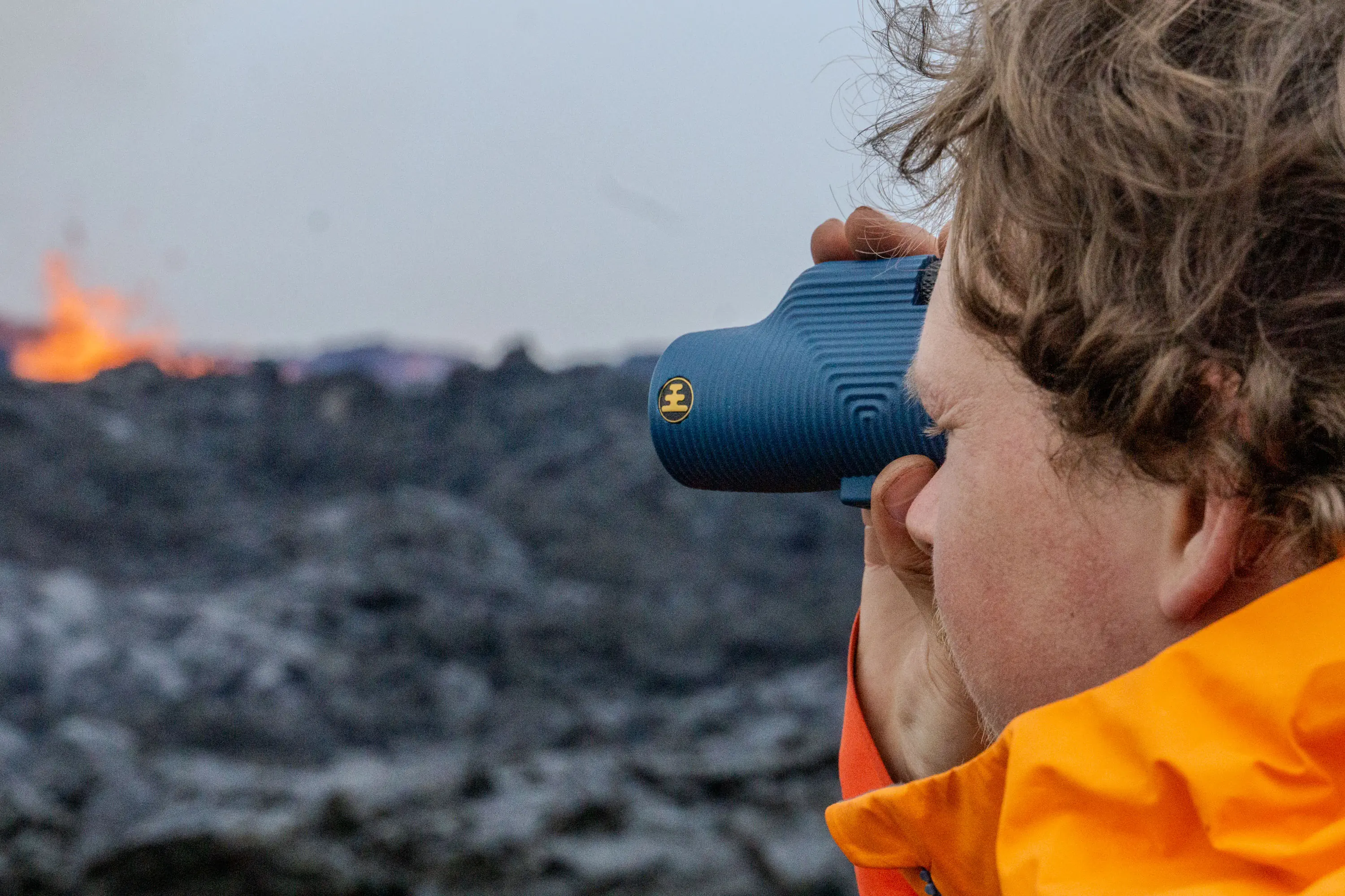 Man holding a monocular