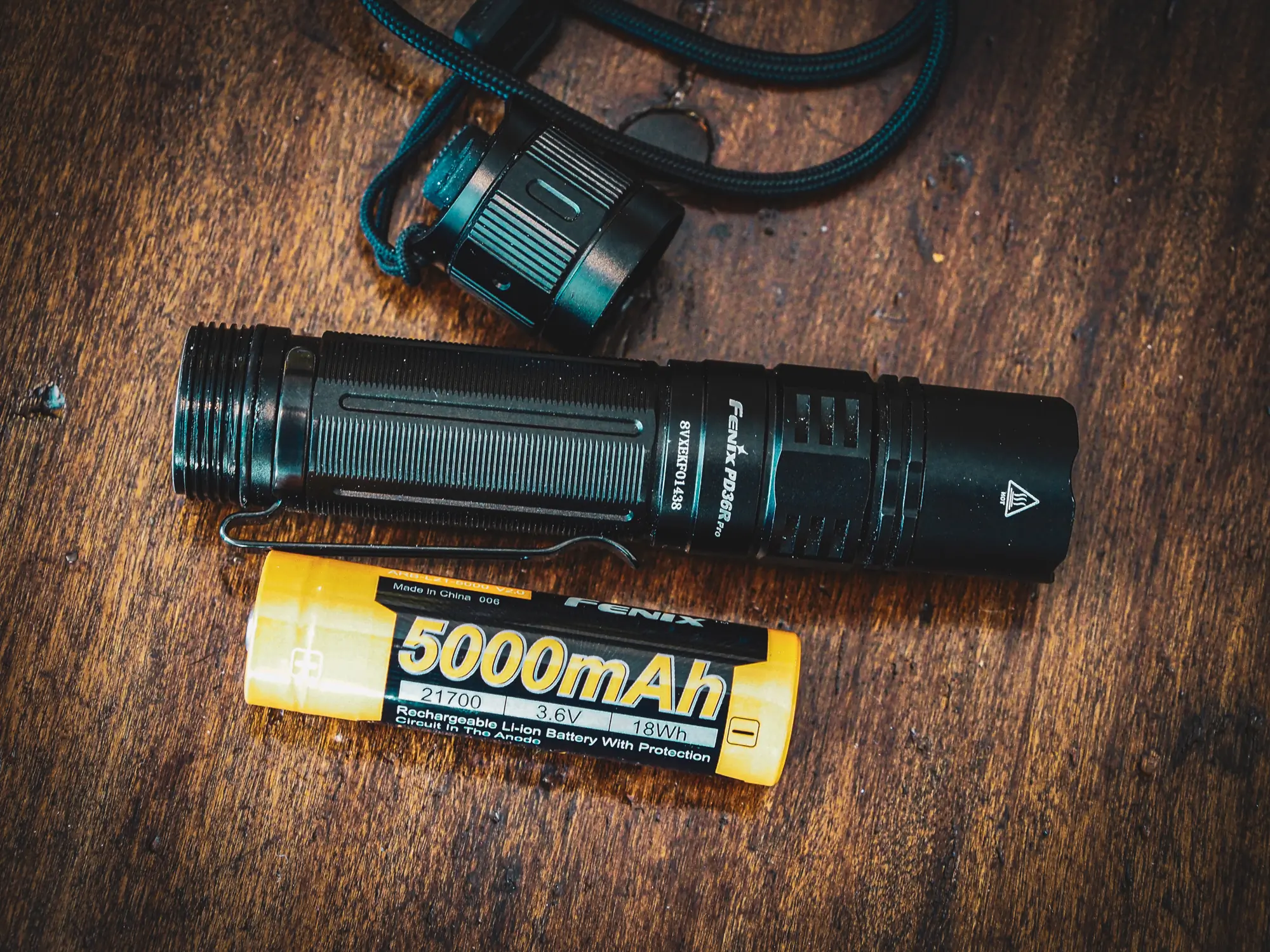 Fenix PD36 Pro Review showing flashlight and battery
