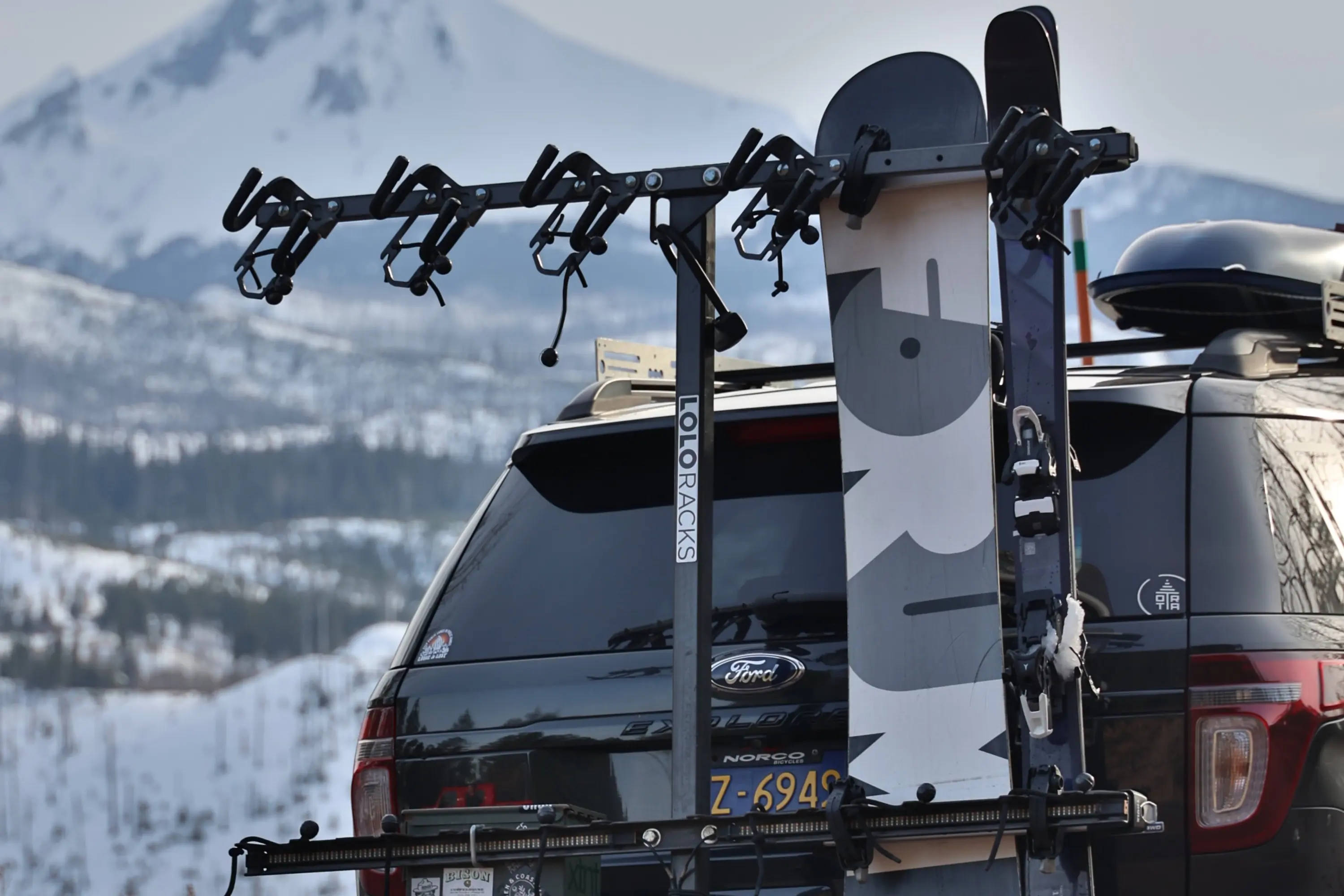 Stock image of the Lolo Rack being used in the winter to carry skis and snowboard