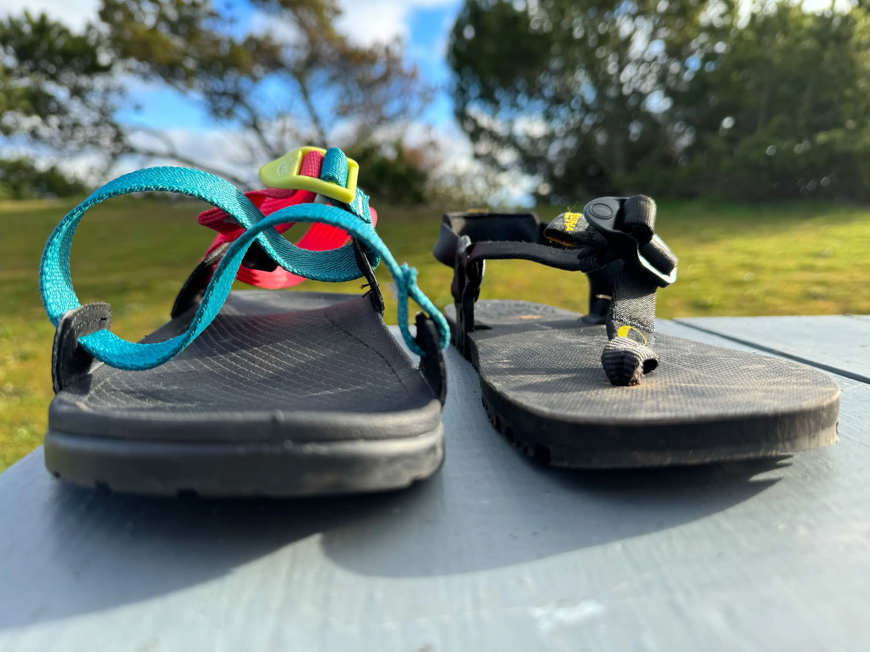 the chaco lowdown side by side with the luna middle bear sandals, showing the difference in footbed design