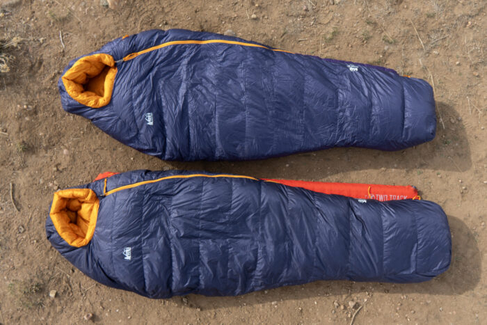 Two Magma sleeping bags in size medium and size long side by side.