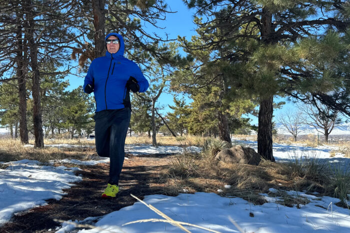 Deviator Jacket has windbreaker shell fabric on front and over shoulders but exposed insulation in the back