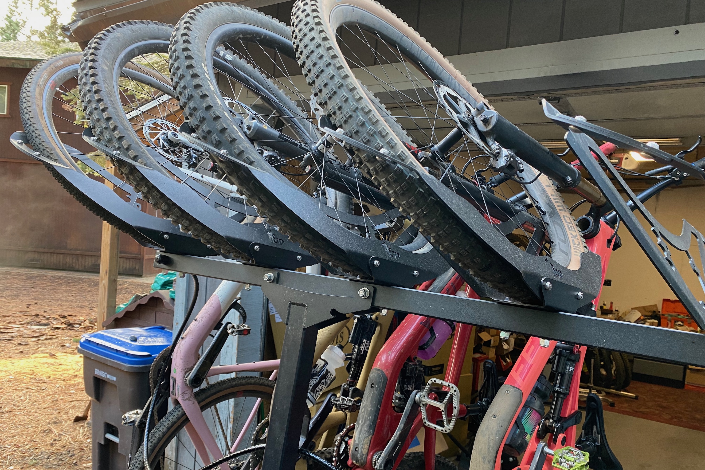 Some vertical racks use whel cradles to support the bikes