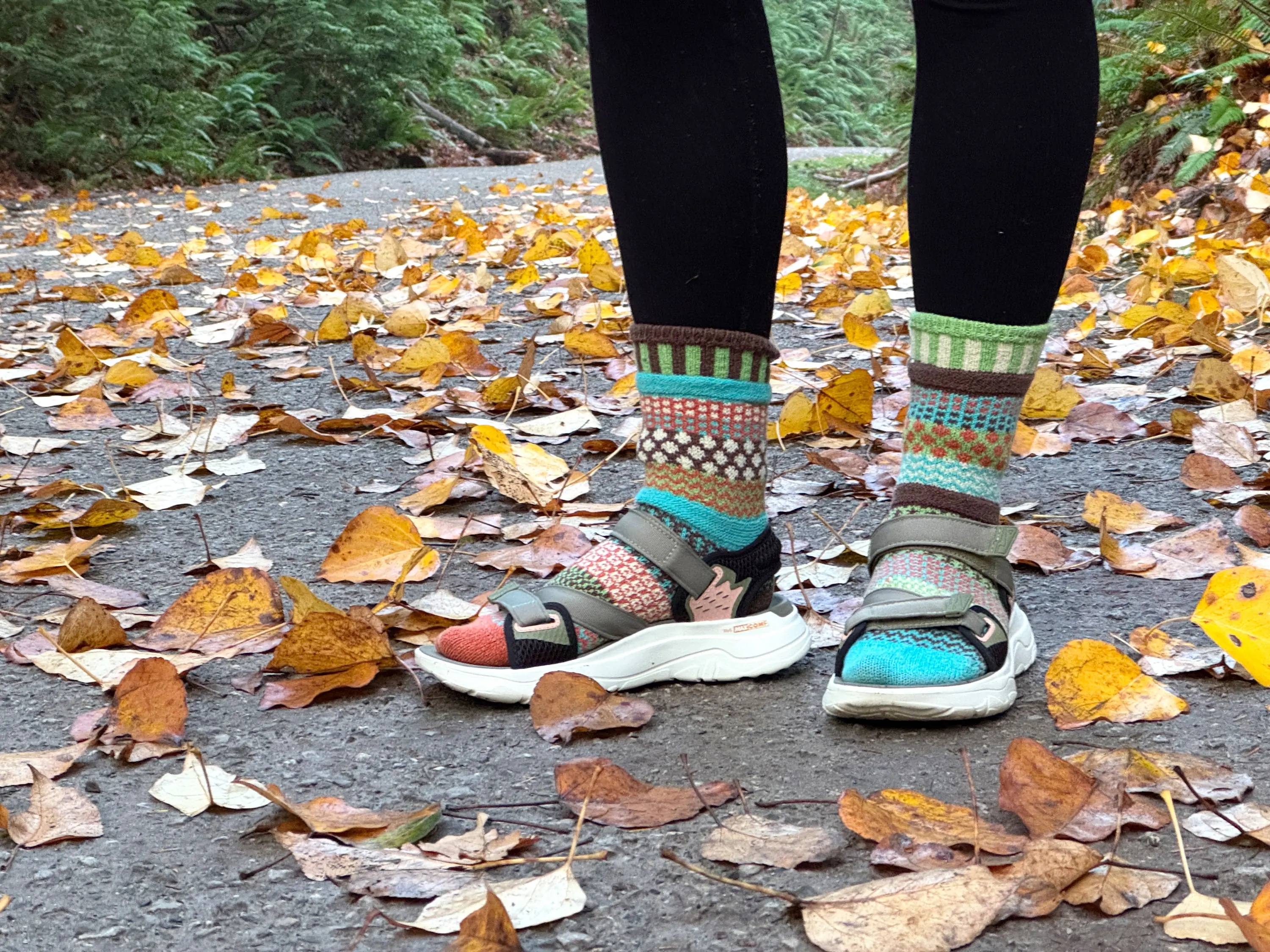 a hiker wearing the teva zymic sandals with a pair of colorful socks