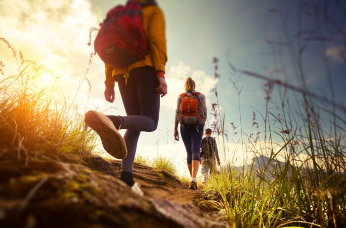 group of hikers morning sun