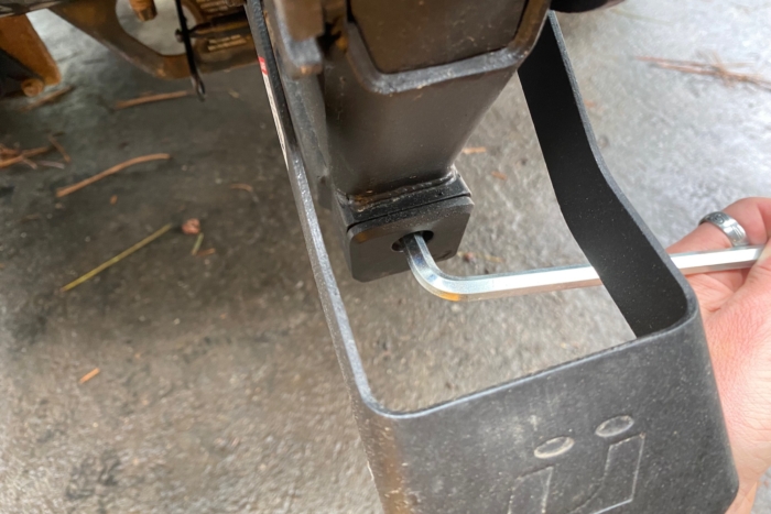 Tightening the anti-wobble cam on the Kuat Transfer with the included security allen key