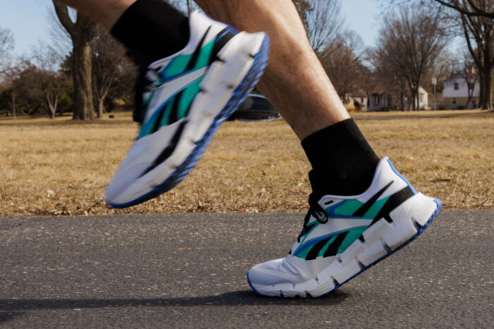 person running in reebok floatzig 1 shoes