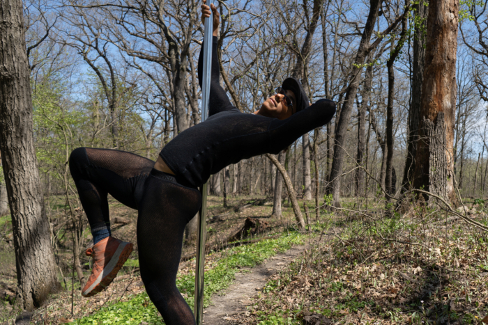 Adventurer in Brynje Thermo Base Layers holds pole, ready for wilderness