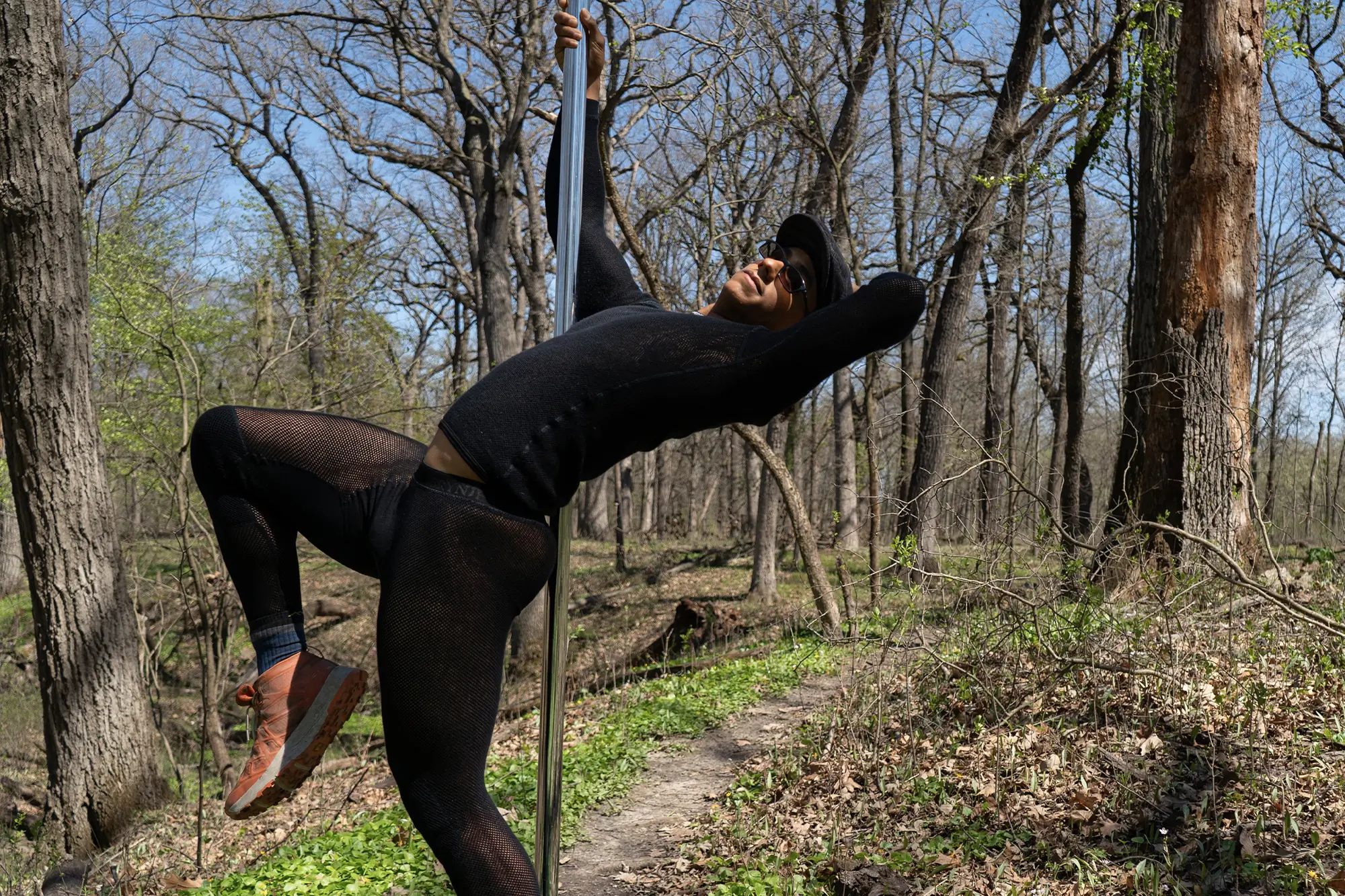 Adventurer in Brynje Thermo Base Layers holds pole, ready for wilderness