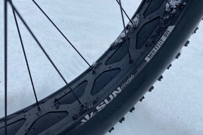 The wide rims of the fat bike wheels on the Ari Kings Peak