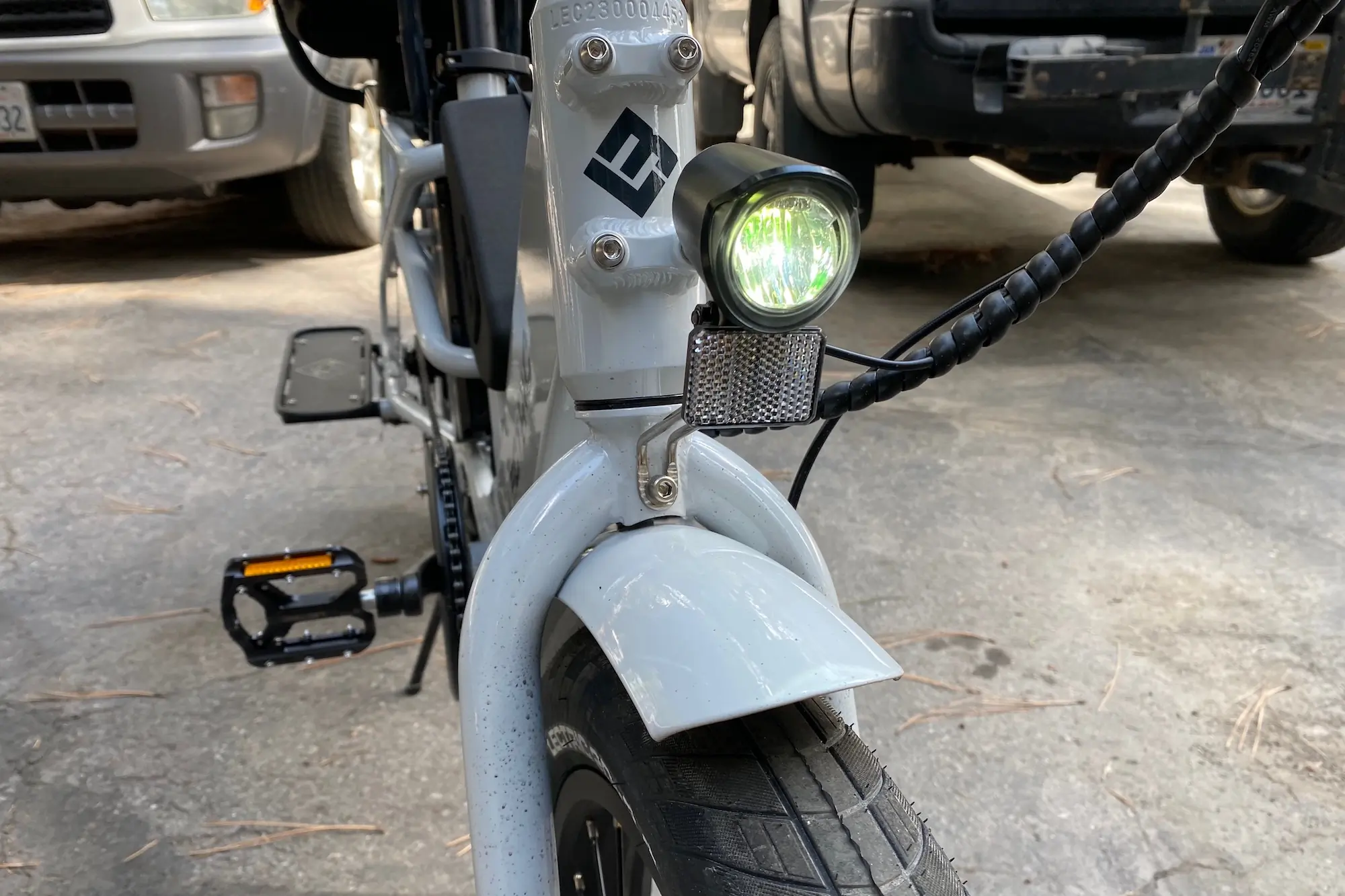 Looking at the front light and fender on the Lectric XPedition cargo e-bike