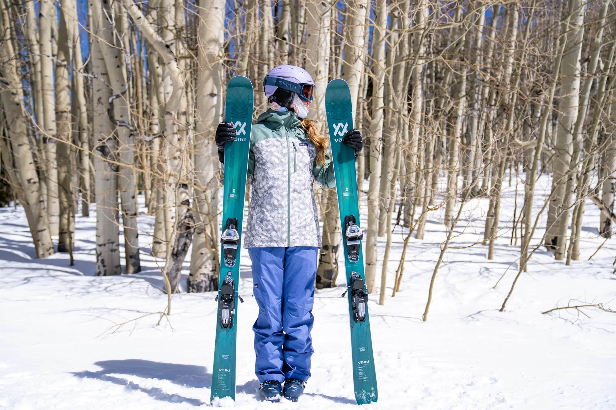 skier standing with skis 