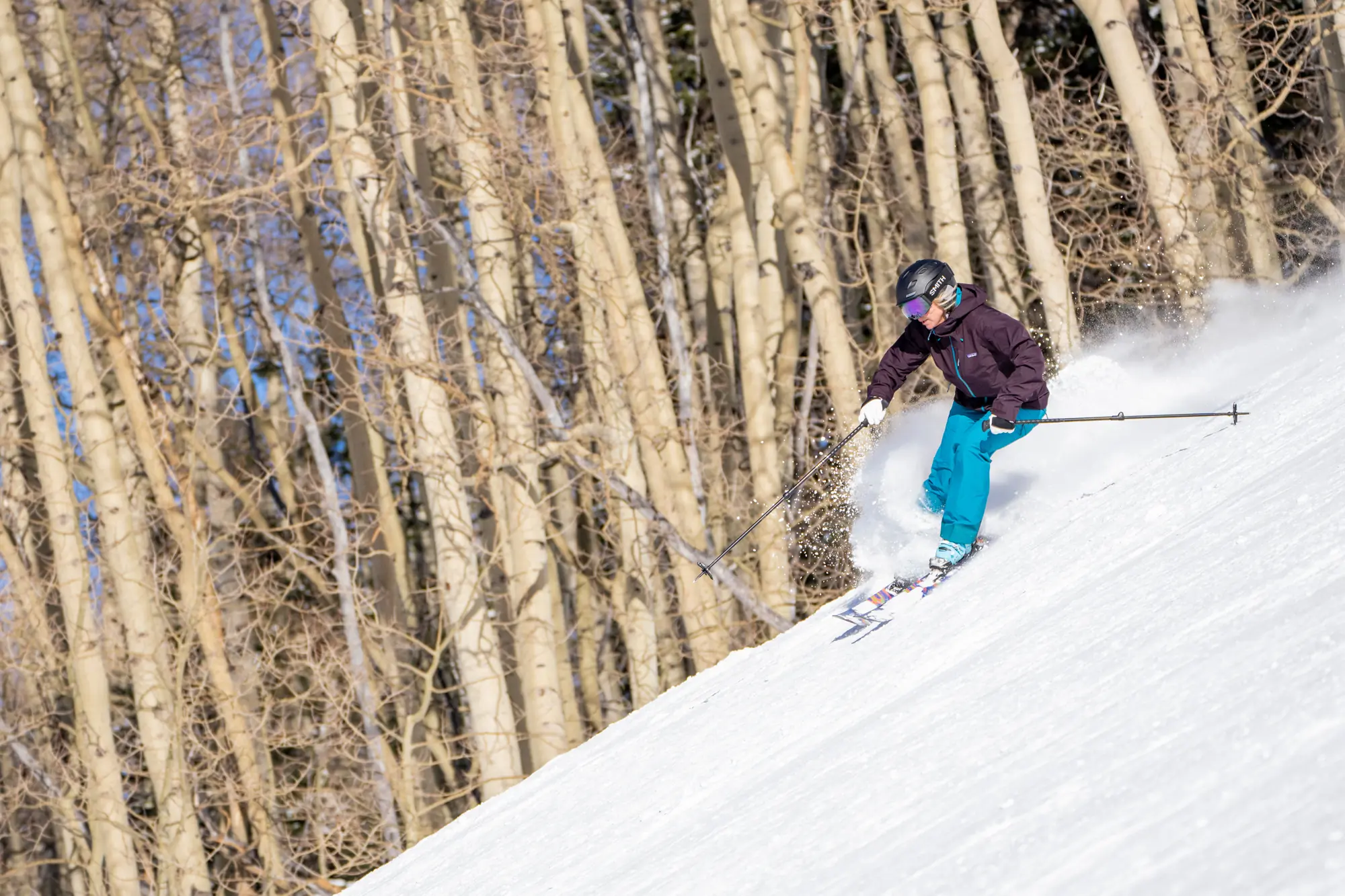 skier turning downhill 
