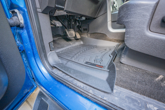 pointed corner of driver's side mat 