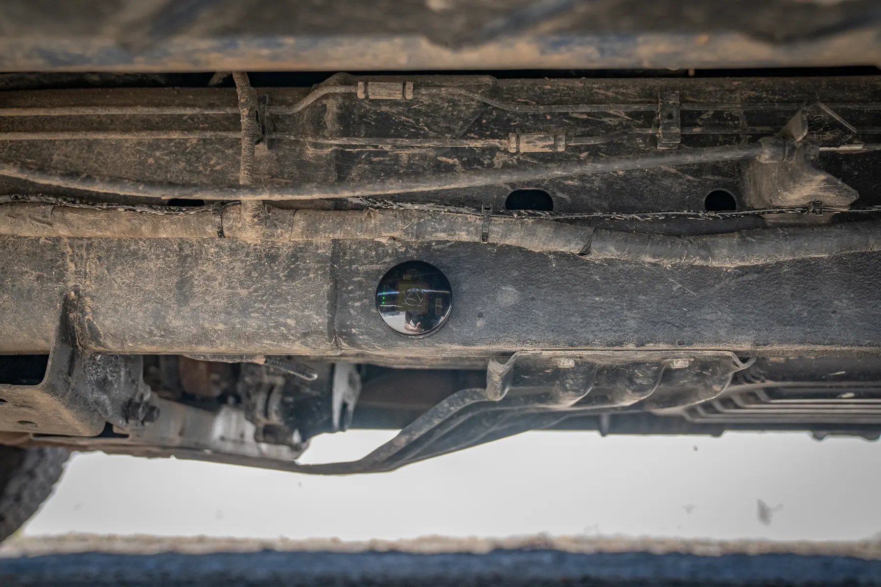gps tracker beneath vehicle
