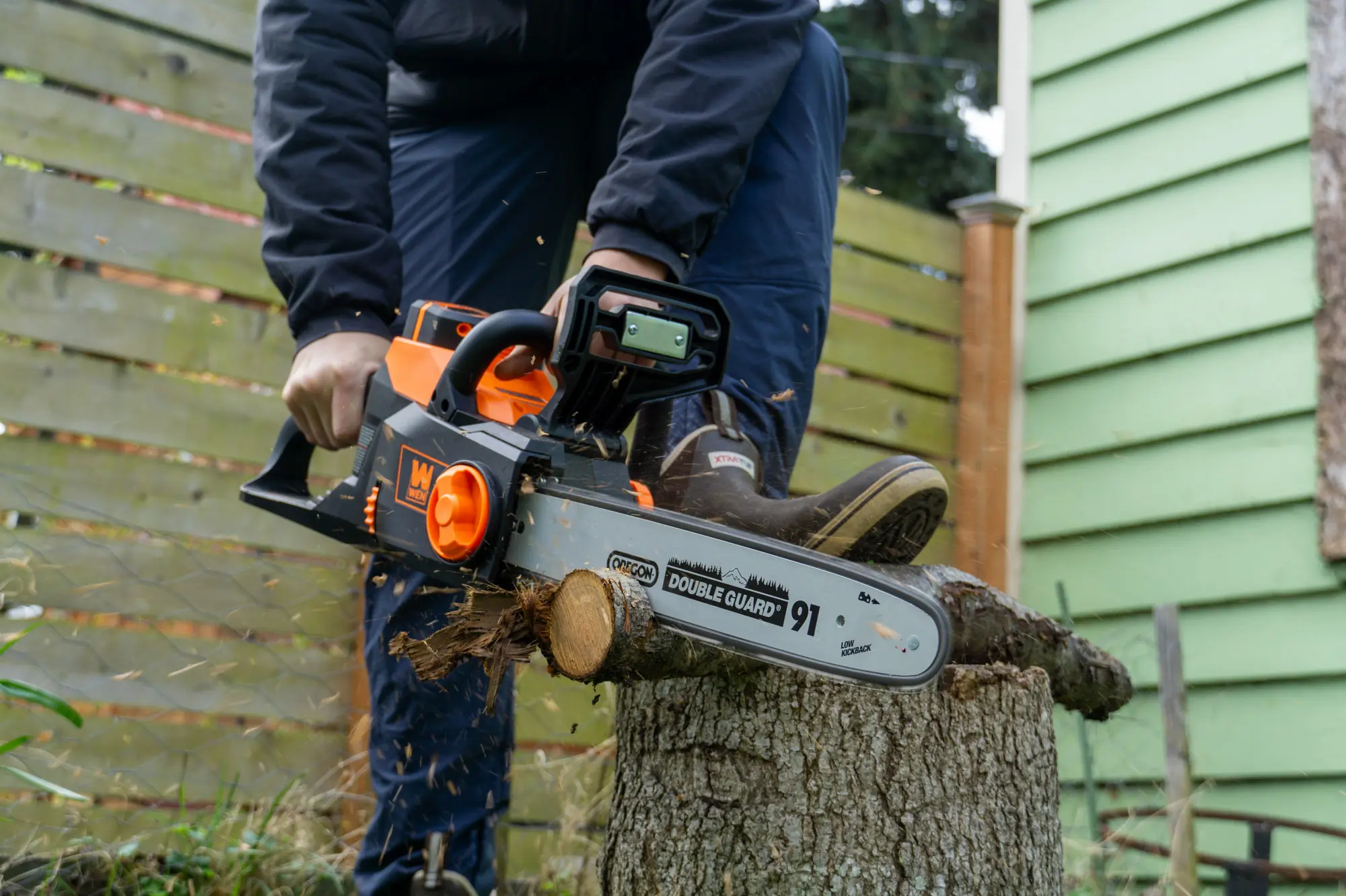 cutting a small log with the WEN electric chainsaw