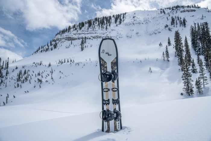 splitboard set in snow with mountain backdrop 
