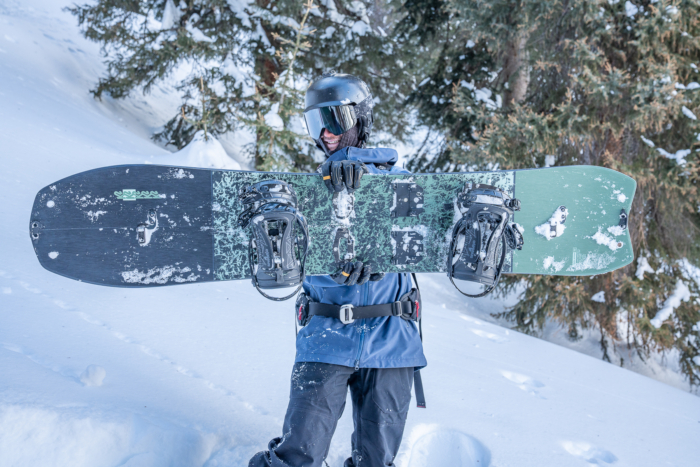 rider holding up splitboard 