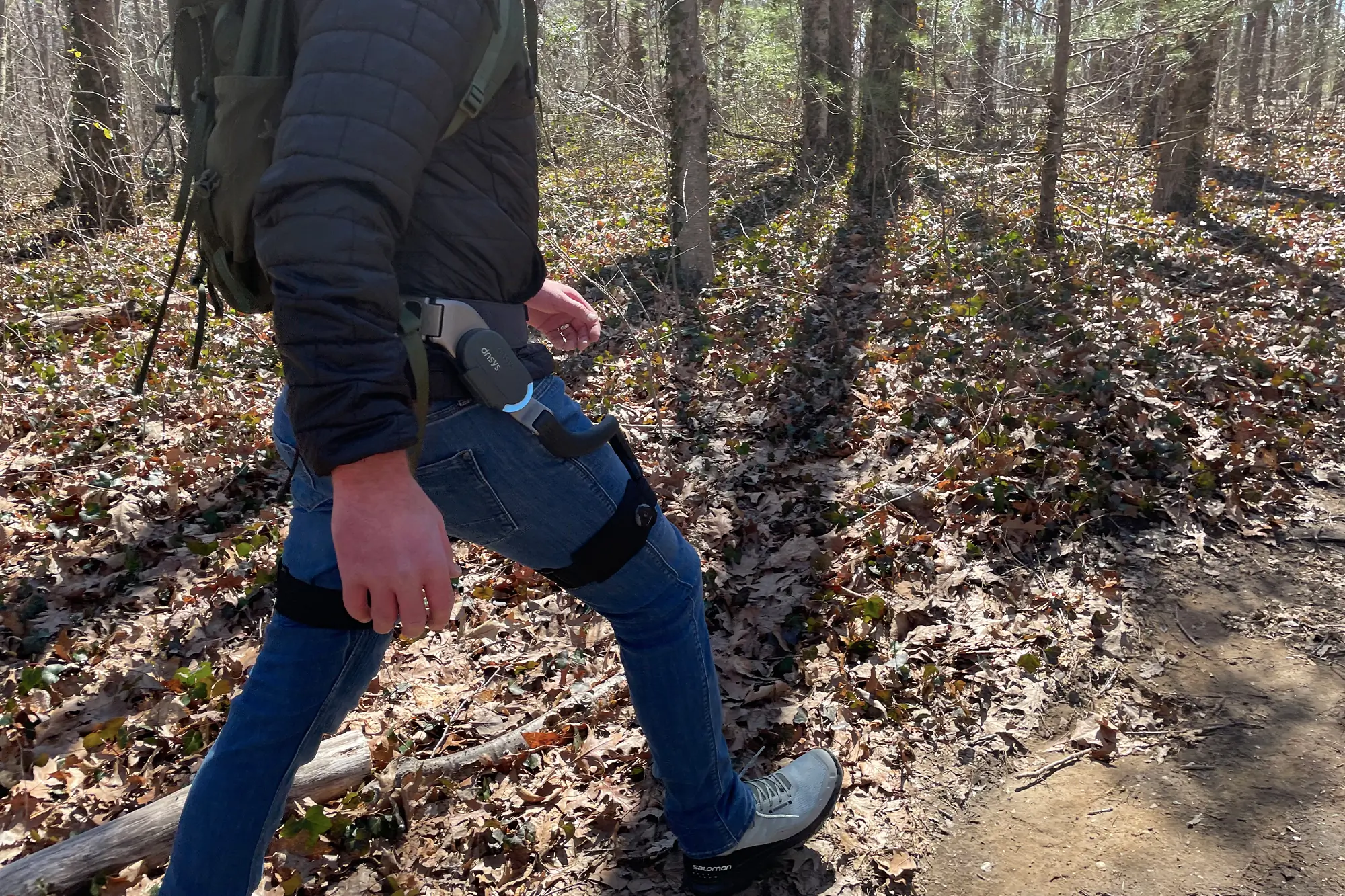 a man wearing Dnsys X1 exoskeleton on trail