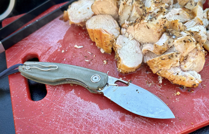 Sliced chicken breast on the board next to the Chilin knife