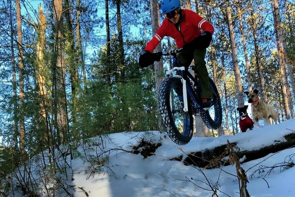 Hitting a small drop on a fat bike with front suspension